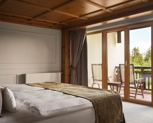 Enjoy the view when you wake up in select Deluxe Double Rooms Our Deluxe Double Room with a bed facing the window