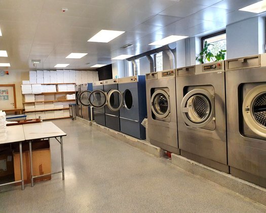 Laundry View of the laundry room with several washing machines
