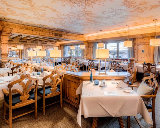 Restaurant View of the dining area with beautifully laid tables in the Interalpen Restaurant an event location in Austria
