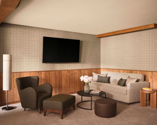Enjoy a spacious living area in the Deluxe Double Room The sofa in the living area and the beverage station in our Deluxe Double Room