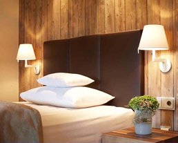 Lodge Premium Zimmer Detail Detailaufnahme eines Bettes in einer Lodge des Hotels